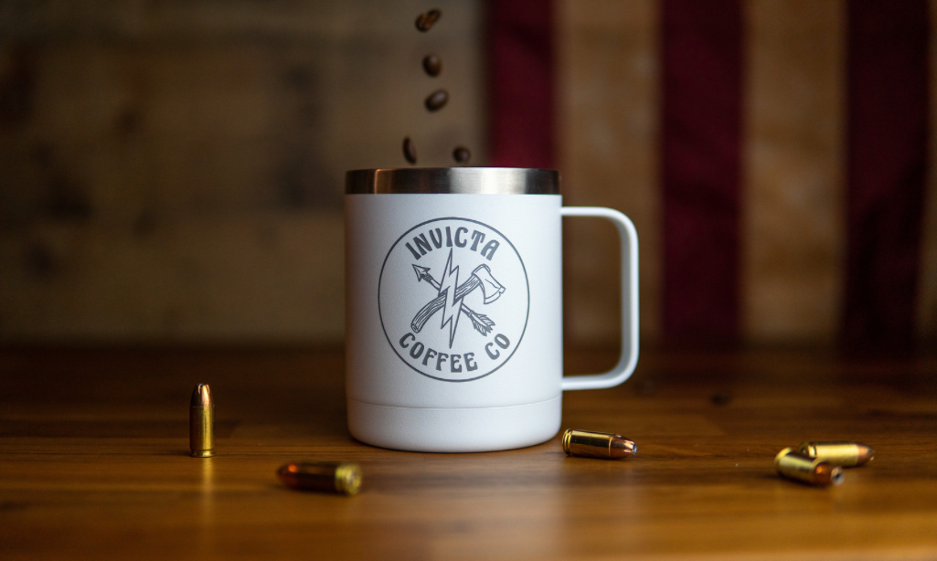 White insulated coffee mug featuring Invitca's hatchet and arrow logo. 